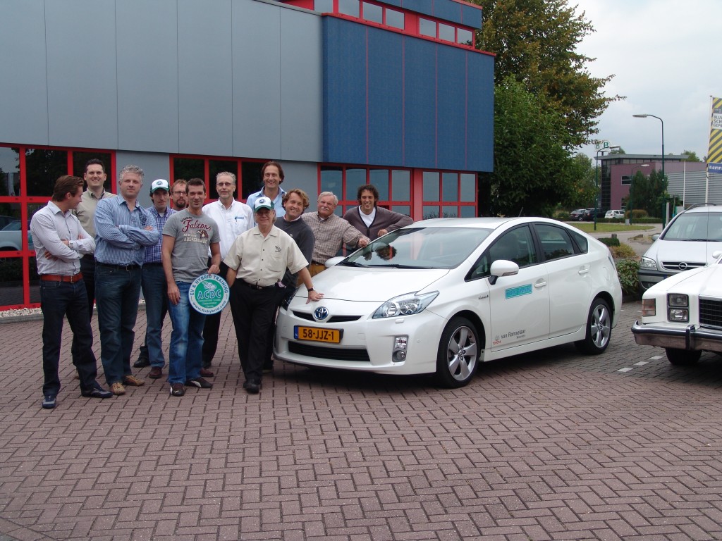 Craig van Batenburg, leaning on the hood of a Prius, in the Netherlands at Midtronics office. 